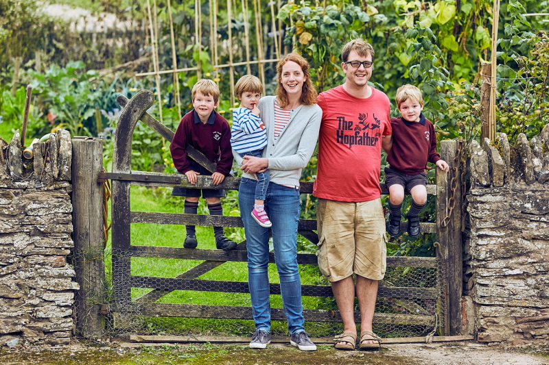 Will and his family outside their home at Brook House Farm